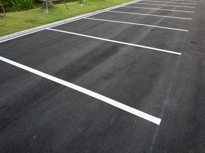 Empty parking with white marking line on floor